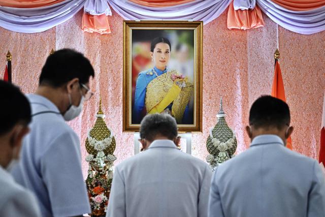 (FILES) Well-wishers bow in front of an image of Thailand's Princess Bajrakitiyabha Mahidol, at Chulalongkorn Hospital in Bangkok on December 16, 2022. Thai Princess Bajrakitiyabha Mahidol, the king's eldest daughter, has died aged 47, the royal palace announced on June 12, 2026, more than three years after she was hospitalised following a sudden illness. (Photo by Lillian SUWANRUMPHA / AFP)