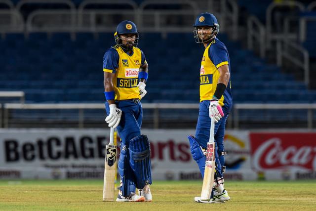 Kamindu Mendis (L) and Dasun Shanaka (R) of Sri Lanka look on after a 50 runs partnership during the first Twenty20 (T20) international cricket match between West Indies and Sri Lanka at Sabina Park in Kingston, Jamaica, on June 11, 2026. (Photo by Randy Brooks / AFP)