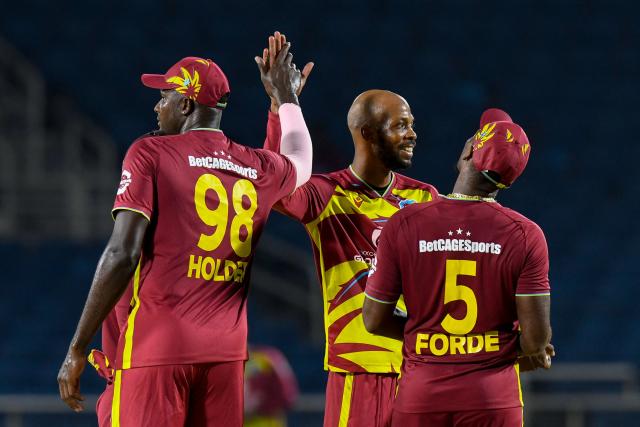 Roston Chase (C) of West Indies celebrates the dismissal of unseen Dasun Shanaka of Sri Lanka during the first Twenty20 (T20) international cricket match between West Indies and Sri Lanka at Sabina Park in Kingston, Jamaica, on June 11, 2026. (Photo by Randy Brooks / AFP)