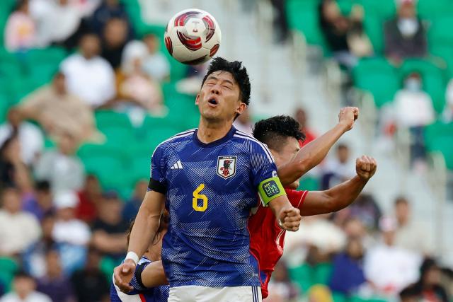 (FILES) Japan's midfielder #06 Wataru Endo heads the ball past Vietnam's forward #10 Pham Tuan Hai during the Qatar 2023 AFC Asian Cup Group D football match between Japan and Vietnam at the Al-Thumama Stadium in Doha on January 14, 2024. Japan captain Wataru Endo was ruled out of the World Cup with injury and announced his international retirement on June 12, 2026, three days before his team's opener against the Netherlands. (Photo by KARIM JAAFAR / AFP)