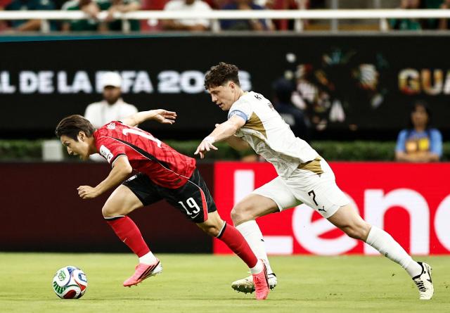 South Korea's midfielder #19 Lee Kang-in and Czech Republic's defender #07 Ladislav Krejci fight for the ball during the 2026 World Cup Group A football match between South Korea and the Czech Republic at the Guadalajara Stadium in Zapopan on June 11, 2026. (Photo by Ulises RUIZ / AFP)