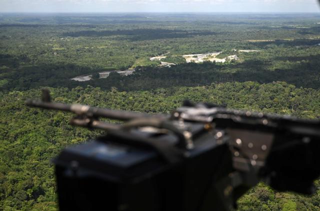 View from a helicopter as Colombian police officers take part in an eradication operation aimed at substituting illicit crops in the municipality of Villagarzon, Putumayo department, Colombia, on June 11, 2026. (Photo by Raul ARBOLEDA / AFP)