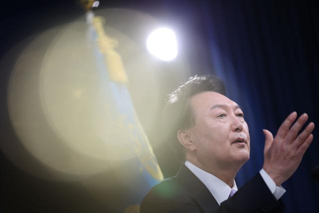 (FILES) South Korean President Yoon Suk Yeol answers a reporter's question during a press conference at the Presidential Office in Seoul on November 7, 2024. South Korea's ex-president Yoon Suk Yeol was sentenced to 30 years in prison on June 12, 2026 for sending drones into North Korea, a move prosecutors argued was aimed at creating a pretext for his disastrous December 2024 declaration of martial law. (Photo by KIM HONG-JI / POOL / AFP)