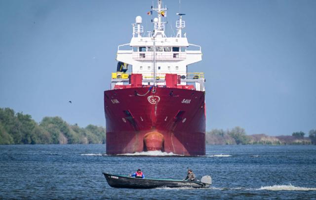 A commercial vessel is sailing on the Sulina branch of the Danube next to Sulina city, Romania, on May 08, 2026. Many Romanians living near the border feel unprotected as dozens of airspace breaches were confirmed. They receive phone alerts about possible drone danger, usually during the night. In four years of war, as Russia bombed Ukrainian ports, Romanians living near the border got used to the sound of drones approaching, sometimes even crashing on national soil. NATO and the European Union are working on a possible "drone wall", with Romania, which shares a 650-km border with Ukraine, asking for capabilities from the middle of the continent to be moved on the eastern flank. (Photo by Daniel MIHAILESCU / AFP)