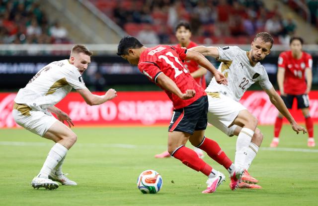 Czech Republic's defender #06 Stepan Chaloupek, South Korea's midfielder #11 Hwang Hee-chan and Czech Republic's midfielder #22 Tomas Soucek fight for the ball during the 2026 World Cup Group A football match between South Korea and the Czech Republic at the Guadalajara Stadium in Zapopan on June 11, 2026. (Photo by Ulises RUIZ / AFP)