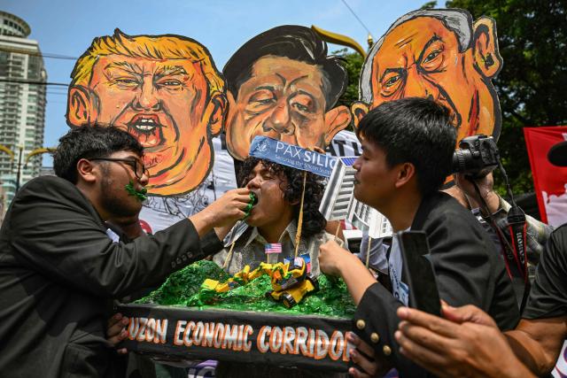 People present a diorama as they protest against the Pax Silica in Manila on June 12, 2026, to coincide with the country’s Independence Day celebrations. (Photo by Jam STA ROSA / AFP)