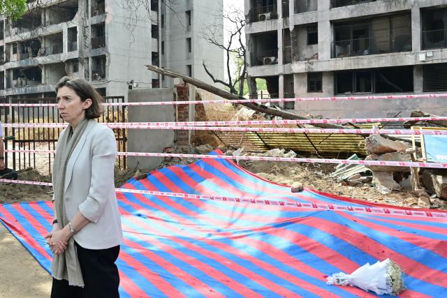 Lindy Cameron, British High Commissioner to India pays tribute at Air India Flight 171 plane crash site on its first anniversary in Ahmedabad on June 12, 2026. India's aviation accident probe agency is facing renewed criticism from pilot groups on the first anniversary of the 2025 Air India Boeing-787 crash in Ahmedabad, which killed 260 people. (Photo by Shammi MEHRA / AFP)