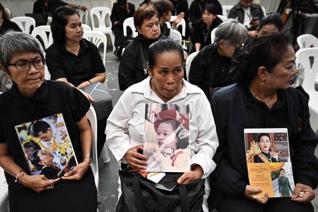 Mourners hold photos of Thai Princess Bajrakitiyabha Mahidol inside Chulalongkorn Hospital in Bangkok on June 12, 2026. Thai Princess Bajrakitiyabha Mahidol, the king's eldest daughter, has died aged 47, the royal palace announced on June 12, more than three years after she was hospitalised following a sudden illness. (Photo by Lillian SUWANRUMPHA / AFP)