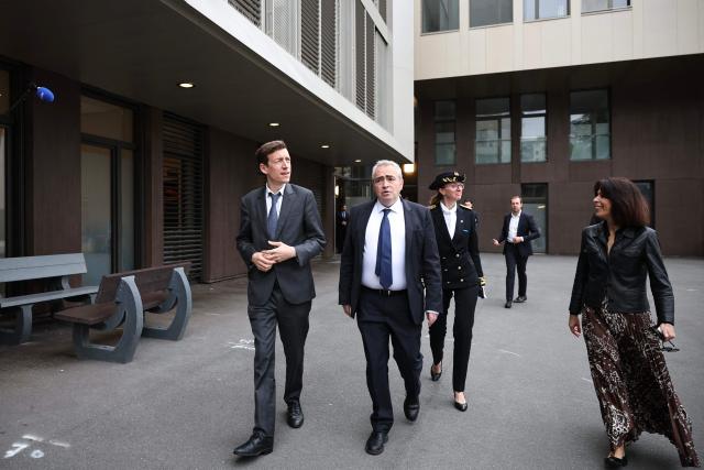 France's Education Minister Edouard Geffray (L) is welcomed by headmaster Damien Doucet (C) as he arrives to pay a visit to students during their mathematics exam as part of the baccalaureate at the Gabriel Faure school and middle school in Paris on June 12, 2026. (Photo by SIMON WOHLFAHRT / AFP)