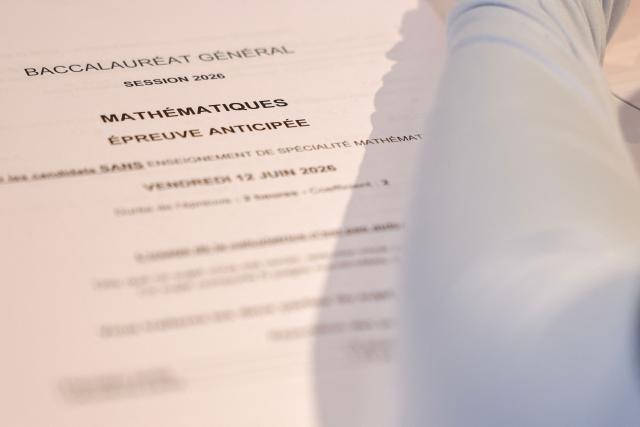 This photograph shows a mathematics exam paper delivered to a student as part of the baccalaureate exam during his visit of France's Education minister at the Gabriel Faure school and middle school in Paris on June 12, 2026. (Photo by SIMON WOHLFAHRT / POOL / AFP)