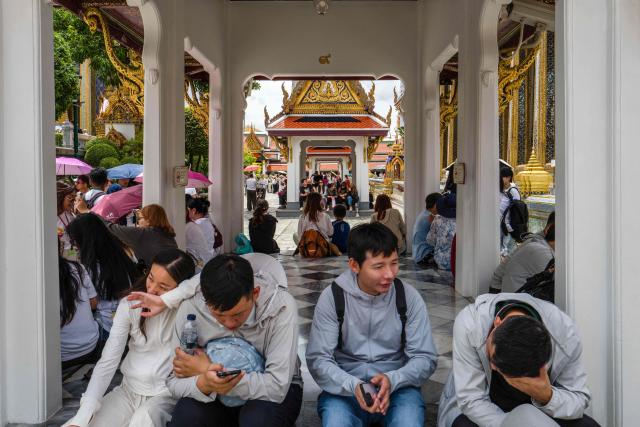 People visit the Grand Palace complex in Bangkok on June 12, 2026. Thai Princess Bajrakitiyabha Mahidol, the king's eldest daughter, has died aged 47, the royal palace announced on June 12, more than three years after she was hospitalised following a sudden illness. (Photo by ANTHONY WALLACE / AFP)
