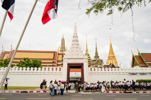 Visitors enter the main entrance gate to the Grand Palace complex in Bangkok on June 12, 2026. Thai Princess Bajrakitiyabha Mahidol, the king's eldest daughter, has died aged 47, the royal palace announced on June 12, more than three years after she was hospitalised following a sudden illness. (Photo by ANTHONY WALLACE / AFP)
