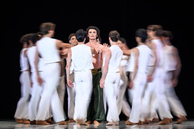 Dancers of the Bejart Ballet Lausanne perform "La Route de la soie" (The Silk Road) a major choreographic work imagined by Maurice Bejart, inspired by the spirit of travel and cultural exchange across Asia, during a dress rehearsal at the Theatre de Beaulieu in Lausanne, June 10, 2026. The show runs until June 14, 2026. (Photo by Fabrice COFFRINI / AFP)