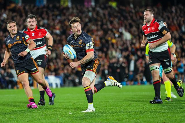 Chiefs' Leroy Carter runs the ball during the Super Rugby semi-final match between the Waikato Chiefs and Canterbury Crusaders at FMG Stadium in Hamilton on June 12, 2026. (Photo by DJ MILLS / AFP)