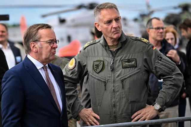 German Defence Minister Boris Pistorius stands next to Inspector of the German Air Force, Lieutenant General Holger Neumann as he tours the International Aerospace Exhibition (ILA) at the BER Airport in Schoenefeld, southeast of Berlin, on June 12, 2026. (Photo by RALF HIRSCHBERGER / AFP)