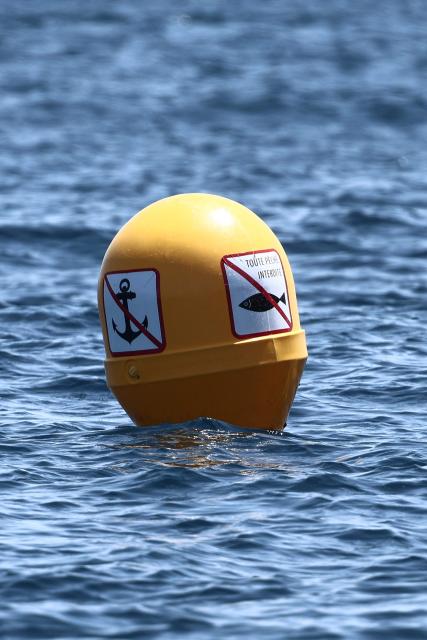 This photograph shows buoys near Anse du Sec and Calanque du Mugel, marking the marine protected area where motorboating and fishing are prohibited in La Ciotat, southeastern France, on June 11, 2026. (Photo by Thibaud MORITZ / AFP)