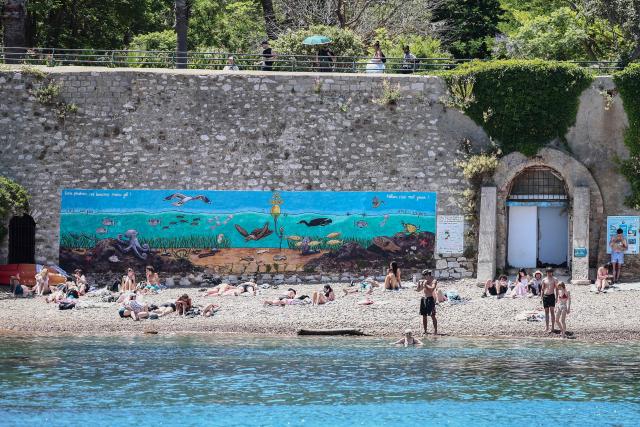 Beachgoers enjoy the beach at Calanque du Grand Mugel in La Ciotat, southeastern France, on June 11, 2026. (Photo by Thibaud MORITZ / AFP)