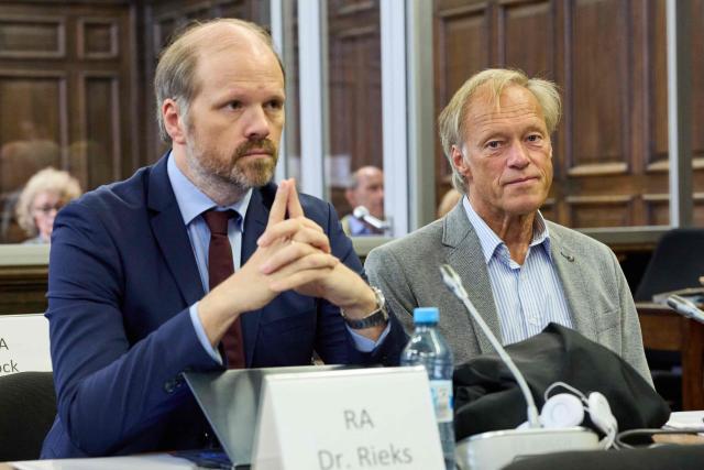 Co-defendant, German former sports journalist Gerhard Delling (R) and his lawyer David Rieks wait for the continuation of the trial over alleged child abduction at the District Court in Hamburg, northern Germany, on June 12, 2026. The public prosecutor's office accuses Block, heiress of a steakhouse chain, of ordering the abduction of her daughter, born in 2010, and her son, born in 2013. According to the indictment, the background to this is an escalating custody dispute over many years between Block and her former husband, who have four children together. (Photo by Georg Wendt / POOL / AFP)