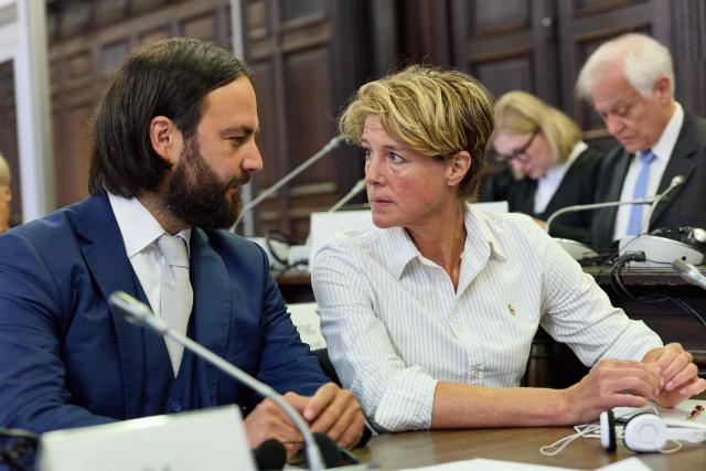 Defendant, German entrepreneur and gastronome Christina Block (R) is seen next to her lawyer Ingo Bott (L) prior to the continuation of the trial over alleged child abduction at the Criminal Court building in Hamburg, northern Germany, on June 12, 2026. The public prosecutor's office accuses Block, heiress of a steakhouse chain, of ordering the abduction of her daughter, born in 2010, and her son, born in 2013. According to the indictment, the background to this is an escalating custody dispute over many years between Block and her former husband, who have four children together. (Photo by Georg Wendt / POOL / AFP)