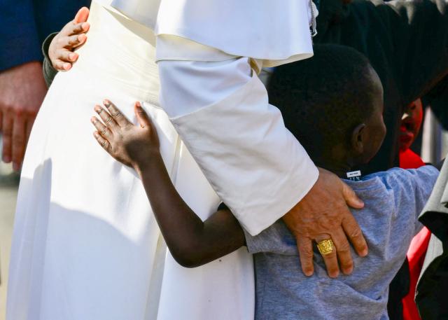 Pope Leo XIV greets children during a meeting with migrants at the “Las Raices" (The Roots) centre in San Cristobal de la Laguna, outside Santa Cruz de Tenerife on the Canary Island of Tenerife on June 12, 2026. Pope Leo XIV is on the final day of a seven-day trip to Spain, including Barcelona and the islands of Gran Canaria and Tenerife where he will meet with migrants and organisations dedicated to helping them. (Photo by Stefano RELLANDINI / AFP)