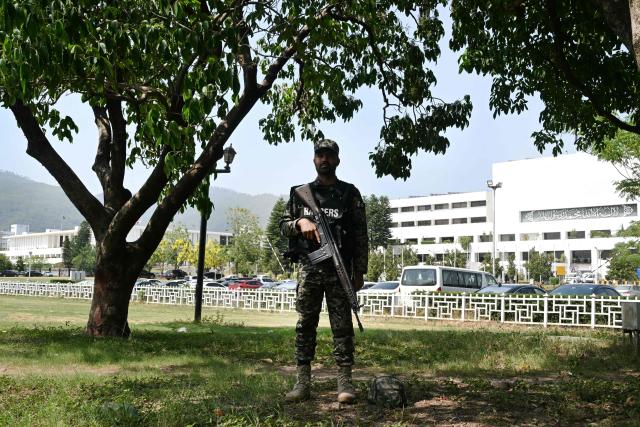 A Pakistani ranger stands guard outside of Parliament House in Islamabad on June 12, 2026, before the start of the budget session. (Photo by Farooq Naeem / AFP)