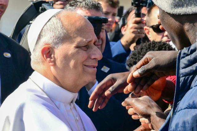 Pope Leo XIV greets migrants at the “Las Raices" (The Roots) centre in San Cristobal de la Laguna, outside Santa Cruz de Tenerife on the Canary Island of Tenerife on June 12, 2026. Pope Leo XIV is on the final day of a seven-day trip to Spain, including Barcelona and the islands of Gran Canaria and Tenerife where he will meet with migrants and organisations dedicated to helping them. (Photo by Stefano RELLANDINI / AFP)