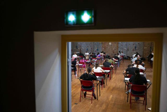 (FILES) Pupils take part in the baccalaureate philosophy exam at the lycee Michel de Montaigne in Mulhouse, eastern France, on June 16, 2025. More than 700,000 candidates across France take the 2026 session of the Baccalaureat or "bac", the secondary school diploma required for access to higher education, with written exams running from June 15 to 18 and oral examinations through early July. (Photo by SEBASTIEN BOZON / AFP)