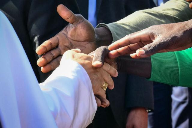 Pope Leo XIV greets migrants at the “Las Raices" (The Roots) centre in San Cristobal de la Laguna, outside Santa Cruz de Tenerife on the Canary Island of Tenerife on June 12, 2026. Pope Leo XIV is on the final day of a seven-day trip to Spain, including Barcelona and the islands of Gran Canaria and Tenerife where he will meet with migrants and organisations dedicated to helping them. (Photo by Stefano RELLANDINI / AFP)