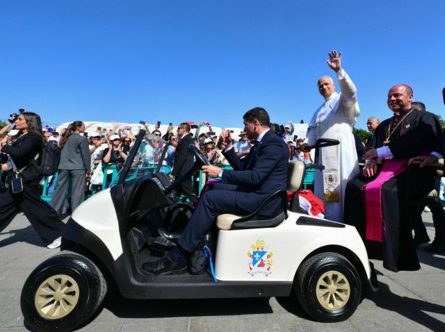 Pope Leo XIV waves as he leaves a meeting with organizations working for the integration of migrants in the Plaza del Cristo de la Laguna, in San Cristobal de la Laguna, outside Santa Cruz de Tenerife, on the Canary Island of Tenerife on June 12, 2026. Pope Leo XIV is the final day of a seven-day trip to Spain, including Barcelona and the islands of Gran Canaria and Tenerife where he will meet with migrants and organisations dedicated to helping them. (Photo by Stefano RELLANDINI / AFP)