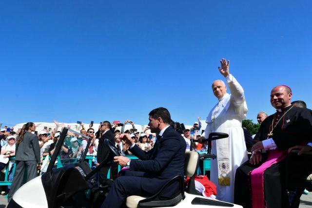Pope Leo XIV waves as he leaves a meeting with organizations working for the integration of migrants in the Plaza del Cristo de la Laguna, in San Cristobal de la Laguna, outside Santa Cruz de Tenerife, on the Canary Island of Tenerife on June 12, 2026. Pope Leo XIV is the final day of a seven-day trip to Spain, including Barcelona and the islands of Gran Canaria and Tenerife where he will meet with migrants and organisations dedicated to helping them. (Photo by Stefano RELLANDINI / AFP)