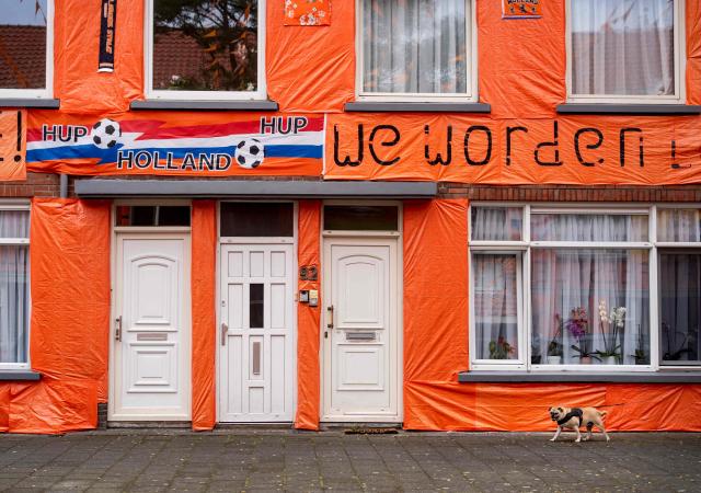 This photograph shows a fan banner in the Marktweg street, decorated and renamed "Oranjestraat" (orange street) by its residents during the 2026 FIFA World Cup football tournament in The Hague on June 12, 2026. The Netherlands will open its 2026 FIFA World Cup Group F campaign co-hosted by the United States, Mexico and Canada, against Japan at the AT&T Stadium in Arlington on June 14, 2026. (Photo by Lina Selg / AFP)