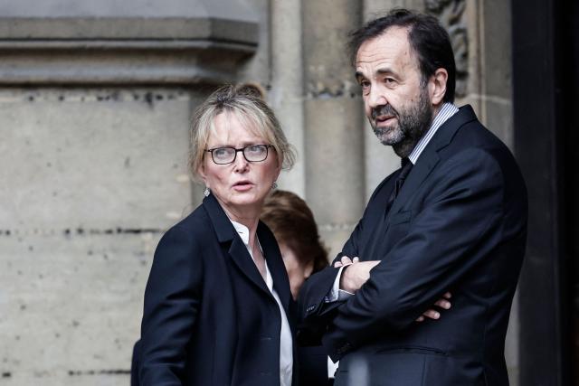 Claude Chirac (L), flanked by her husband Frederic Salat-Baroux (R), arrives for the funeral ceremony of her mother late Bernadette Chirac, widow of former French president Jacques Chirac at the Basilica Sainte-Clotilde, in Paris on June 12, 2026. Bernadette Chirac passed away at 93 years old on June 5. She stood by her late husband, former French president Jacques Chirac, during 12 years as first lady, but also forged her own, more discreet, political career. (Photo by STEPHANE DE SAKUTIN / AFP)