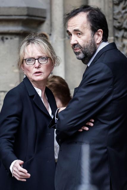 Claude Chirac (L), flanked by her husband Frederic Salat-Baroux (R), arrives for the funeral ceremony of her mother late Bernadette Chirac, widow of former French president Jacques Chirac at the Basilica Sainte-Clotilde, in Paris on June 12, 2026. Bernadette Chirac passed away at 93 years old on June 5. She stood by her late husband, former French president Jacques Chirac, during 12 years as first lady, but also forged her own, more discreet, political career. (Photo by STEPHANE DE SAKUTIN / AFP)