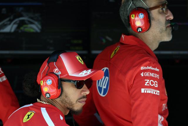 Ferrari's British driver Lewis Hamilton (L) is seen during the first practice session at the Circuit de Catalunya ahead of the Catalonia Formula One Grand Prix in Montmelo, on the outskirts of Barcelona on June 12, 2026. (Photo by Lluis GENE / AFP)
