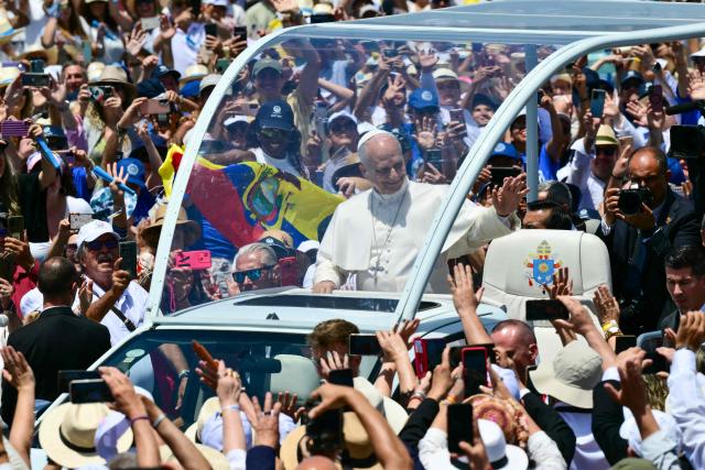 Pope Leo XIV waves from the popmobile as he arrives to lead a Holy mass at the port of Santa Cruz de Tenerife, on the Canary Island of Tenerife on June 12, 2026. Pope Leo XIV is on the final day of a seven-day trip to Spain, including Madrid, Barcelona and the islands of Gran Canaria and Tenerife where he met with migrants and organisations dedicated to helping them. (Photo by Stefano RELLANDINI / AFP)