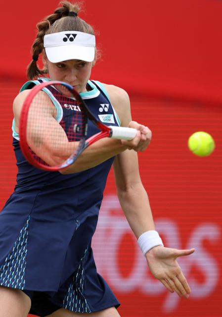 Kazakhstan's Elena Rybakina returns the ball during her round of 16 women's singles match against Germany's Tatjana Maria at the HSBC WTA tennis Championships at Queen's Club in west London on June 12, 2026. (Photo by Adrian Dennis / AFP)