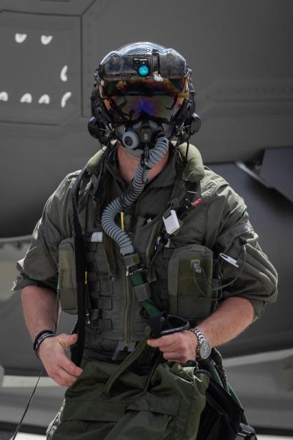A pilot of one of the three US-made F-35 aircraft (Polish codename Husarz) in the Polish Air Force is pictried wearing his gear and mask after landing at the 32nd Tactical Air Base in Lask, central Poland, on June 12, 2026, on the day of their official entry into service with the Polish Air Force. (Photo by Wojtek RADWANSKI / AFP)
