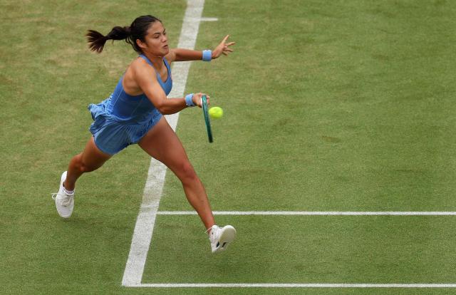 Britain's Emma Raducanu returns against Romania's Sorana Cirstea during their round of 16 women's singles match at the HSBC WTA tennis Championships at Queen's Club in west London on June 12, 2026. (Photo by Adrian Dennis / AFP)