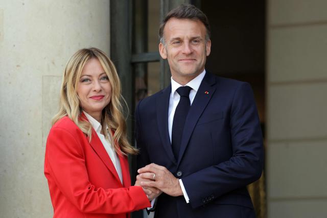 (FILES) France's President Emmanuel Macron (R) welcomes Italy's Prime Minister Giorgia Meloni ahead of a meeting of allies to consider sending a multinational force to ensure security and free-flowing trade in the Strait of Hormuz, at the presidential Elysee Palace in Paris on April 17, 2026. French President Emmanuel Macron will host Italian Prime Minister Giorgia Meloni on 25 June in Antibes (in south France) for their first bilateral summit since she took office in 2022, the Йlysйe Palace announced on June 12, 2026. ‘This summit will provide an opportunity to deepen Franco-Italian cooperation in several strategic sectors, in particular defence, space, energy and infrastructure,’ the French presidency added. (Photo by Ludovic MARIN / AFP)