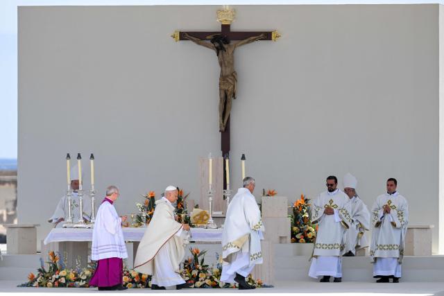 Pope Leo XIV leads a Holy mass at the port of Santa Cruz de Tenerife, on the Canary Island of Tenerife on June 12, 2026. Pope Leo XIV is on the final day of a seven-day trip to Spain, including Madrid, Barcelona and the islands of Gran Canaria and Tenerife where he met with migrants and organisations dedicated to helping them. (Photo by JORGE GUERRERO / AFP)