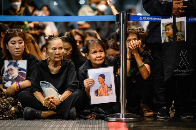 Mourners hold photos of Thai Princess Bajrakitiyabha Mahidol inside Chulalongkorn Hospital in Bangkok on June 12, 2026. Thai Princess Bajrakitiyabha Mahidol, the king's eldest daughter, has died aged 47, the royal palace announced on June 12, more than three years after she was hospitalised following a sudden illness. (Photo by ANTHONY WALLACE / AFP)