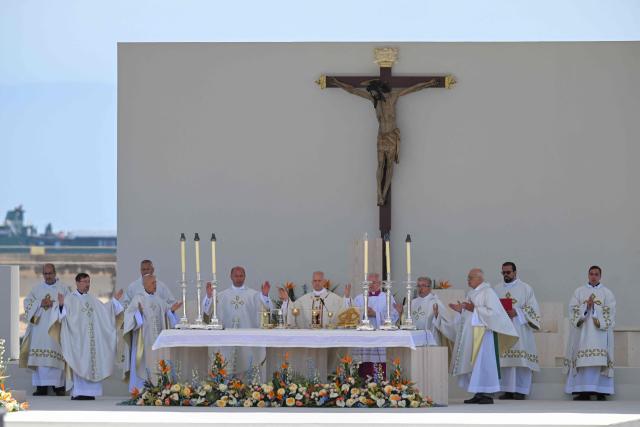 Pope Leo XIV leads a Holy mass at the port of Santa Cruz de Tenerife, on the Canary Island of Tenerife on June 12, 2026. Pope Leo XIV is on the final day of a seven-day trip to Spain, including Madrid, Barcelona and the islands of Gran Canaria and Tenerife where he met with migrants and organisations dedicated to helping them. (Photo by JORGE GUERRERO / AFP)