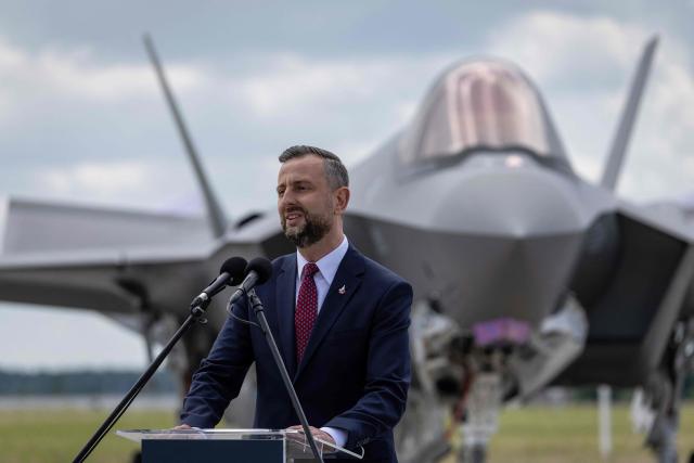 Poland's Deputy Prime Minister and Minister of Defence Wladyslaw Kosiniak Kamysz speaks during the ceremony for the official entry into service with the Polish Air Force of the first tree US-made F-35 aircrafts (Polish codename Husarz) on June 12, 2026, at the 32nd Tactical Air Base in Lask, central Poland. (Photo by Wojtek RADWANSKI / AFP)