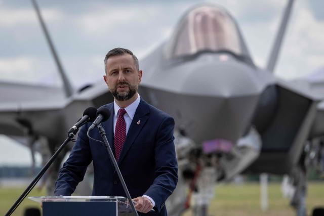 Poland's Deputy Prime Minister and Minister of Defence Wladyslaw Kosiniak Kamysz speaks during the ceremony for the official entry into service with the Polish Air Force of the first tree US-made F-35 aircrafts (Polish codename Husarz) on June 12, 2026, at the 32nd Tactical Air Base in Lask, central Poland. (Photo by Wojtek RADWANSKI / AFP)