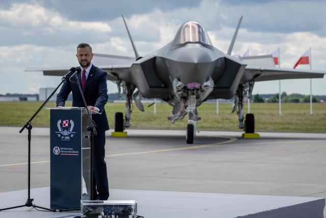 Poland's Deputy Prime Minister and Minister of Defence Wladyslaw Kosiniak Kamysz speaks during the ceremony for the official entry into service with the Polish Air Force of the first tree US-made F-35 aircrafts (Polish codename Husarz) on June 12, 2026, at the 32nd Tactical Air Base in Lask, central Poland. (Photo by Wojtek RADWANSKI / AFP)