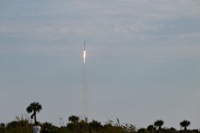 A SpaceX Falcon 9 rocket carrying the Starlink 10-54 mission lifts off from Space Launch Complex 40 at Cape Canaveral Space Force Station in Cape Canaveral, Florida, on June 12, 2026. Elon Musk's SpaceX begins trading on the Nasdaq exchange on Friday with the biggest initial public offering in history expected to make the polarizing entrepreneur the world's first trillionaire. The company priced more than 555 million shares at $135 each in a filing with the US markets regulator on Thursday, placing SpaceX in the top 10 of Wall Street's biggest companies with a valuation of just under $1.8 trillion -- ahead of Tesla, Facebook-owner Meta and Walmart. (Photo by CHANDAN KHANNA / AFP)