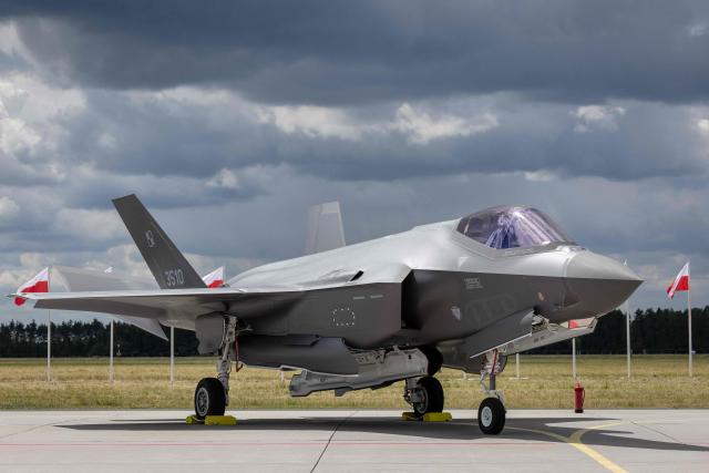 US-made F-35 aircraft (Polish codename Husarz) of the Polish Air Force is seen parked on the tarmac at the 32nd Tactical Air Base in Lask, central Poland, on June 12, 2026, on the day of their official entry into service with the Polish Air Force. (Photo by Wojtek RADWANSKI / AFP)