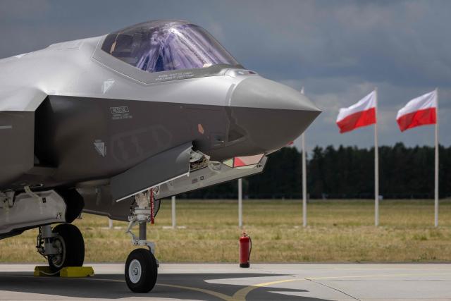 US-made F-35 aircraft (Polish codename Husarz) of the Polish Air Force is seen parked on the tarmac at the 32nd Tactical Air Base in Lask, central Poland, on June 12, 2026, on the day of their official entry into service with the Polish Air Force. (Photo by Wojtek RADWANSKI / AFP)