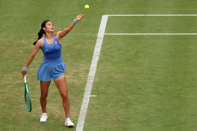 Britain's Emma Raducanu throws the ball to serve against Romania's Sorana Cirstea during their round of 16 women's singles match at the HSBC WTA tennis Championships at Queen's Club in west London on June 12, 2026. Raducanu won the match 6-4, 6-2. (Photo by Adrian Dennis / AFP)