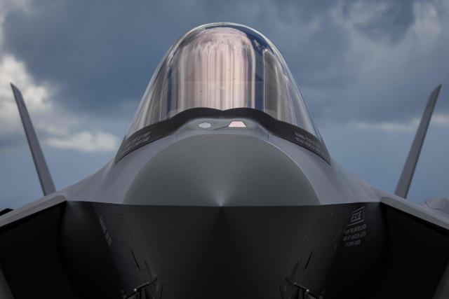 The nose and cockpit window of a US-made F-35 aircraft (Polish codename Husarz) of the Polish Air Force is pictured while parked on the tarmac at the 32nd Tactical Air Base in Lask, central Poland, on June 12, 2026, on the day of their official entry into service with the Polish Air Force. (Photo by Wojtek RADWANSKI / AFP)